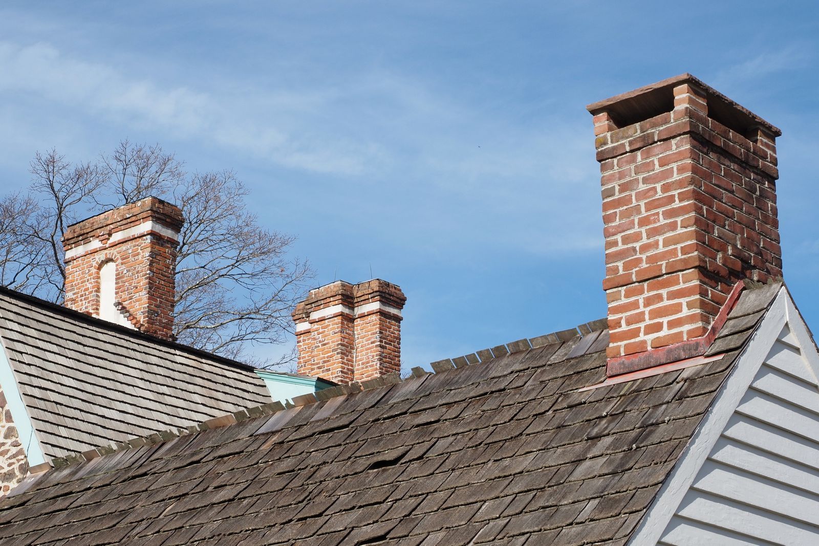 Brick chimneys on a cedar-shake roof