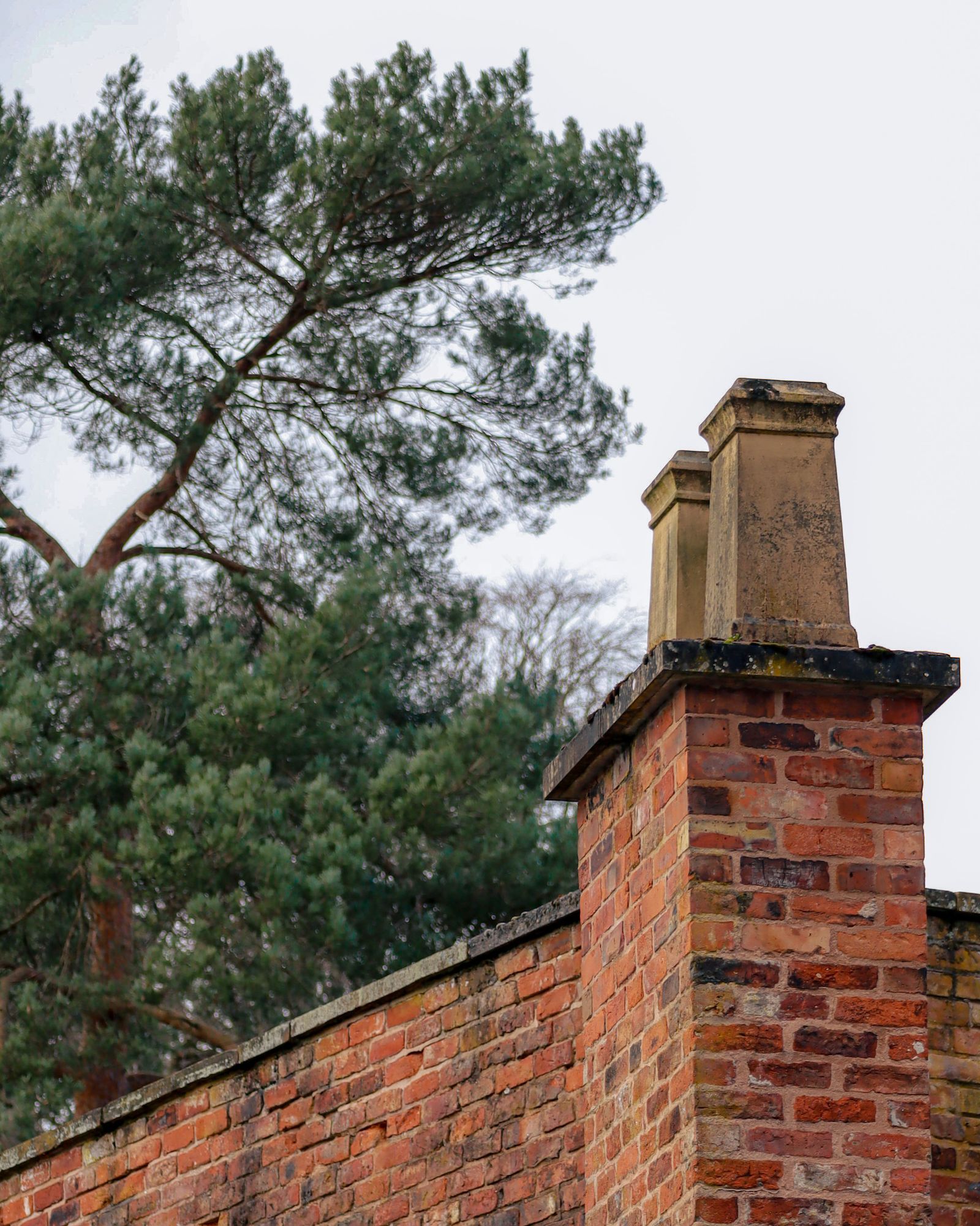 Brick chimney with cap and crown