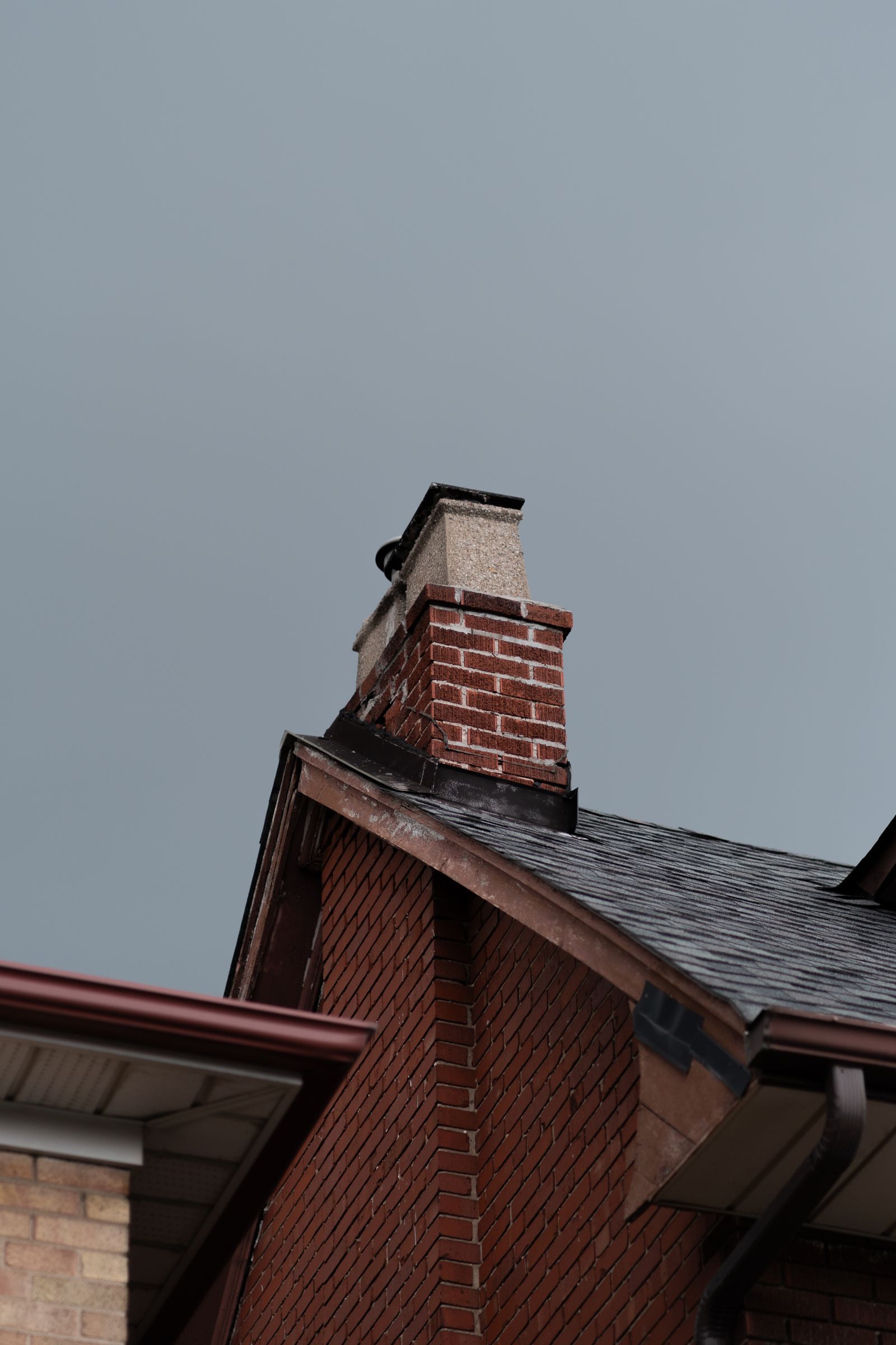 Brick chimney above the roof line