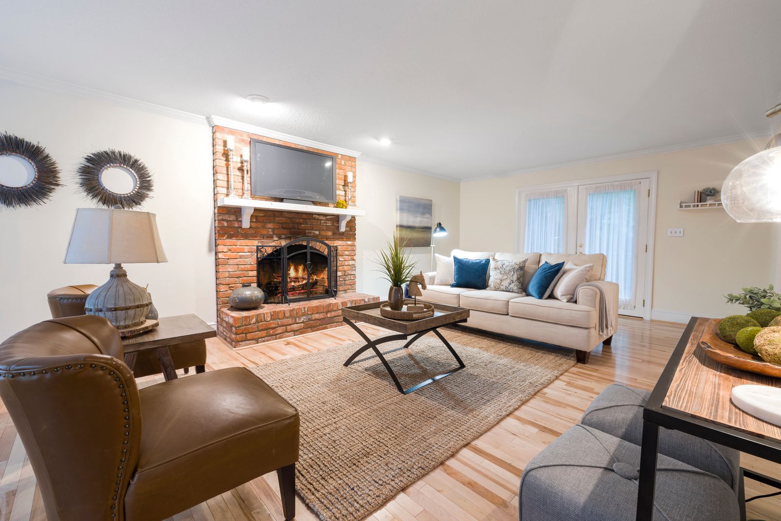 Living room with a brick fireplace