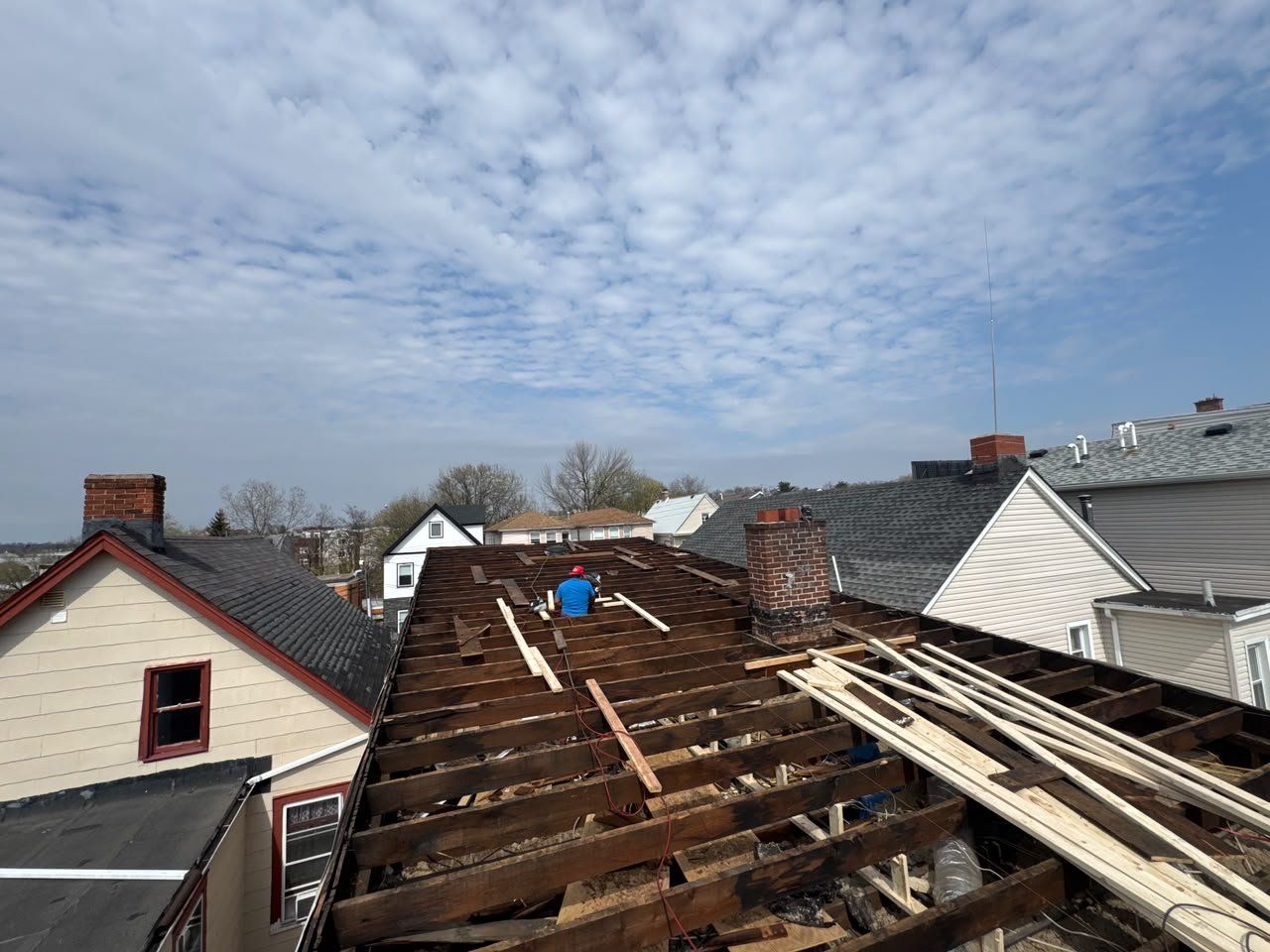 Flat roof stripped down to the joists between row houses