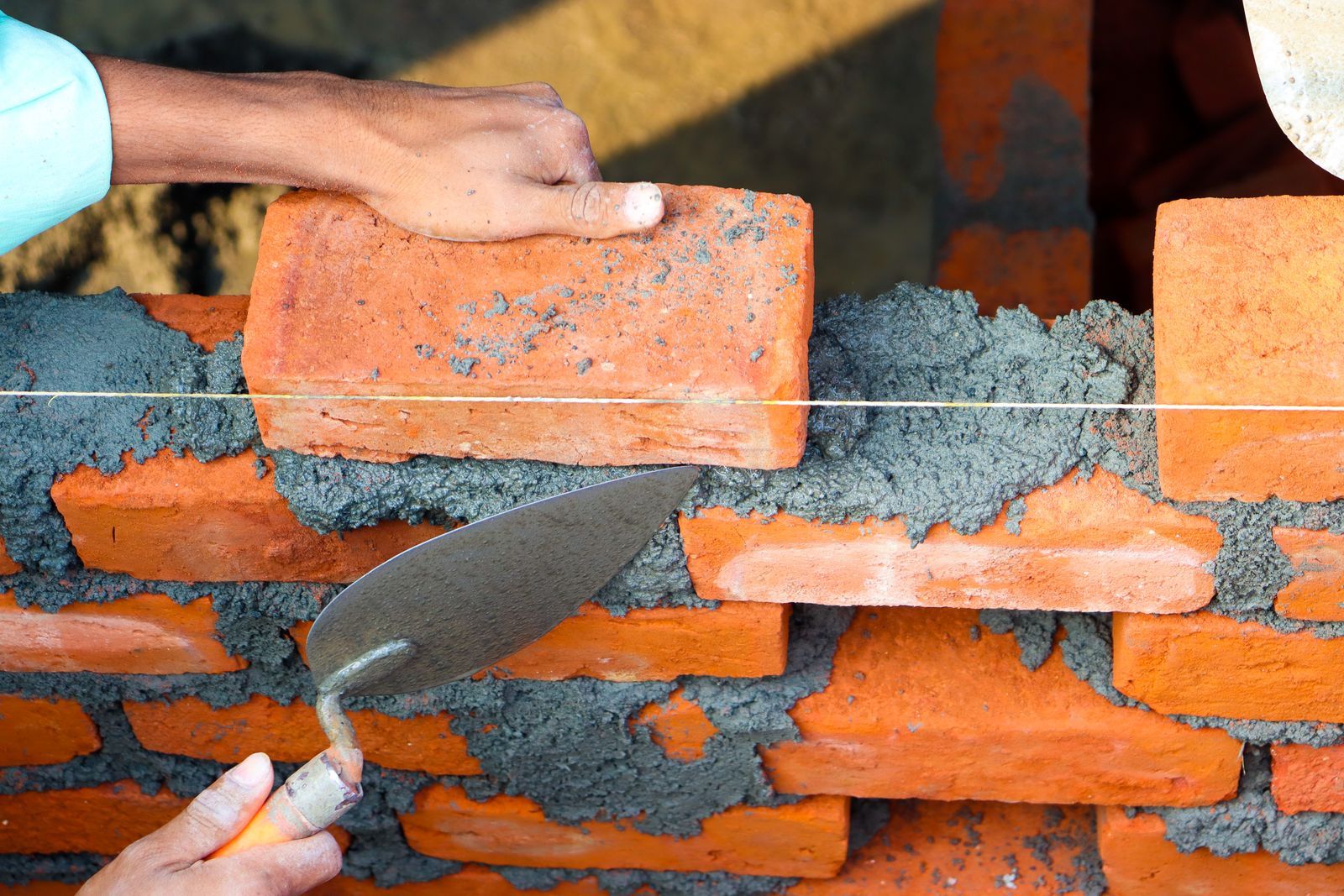 Laying brick with a trowel