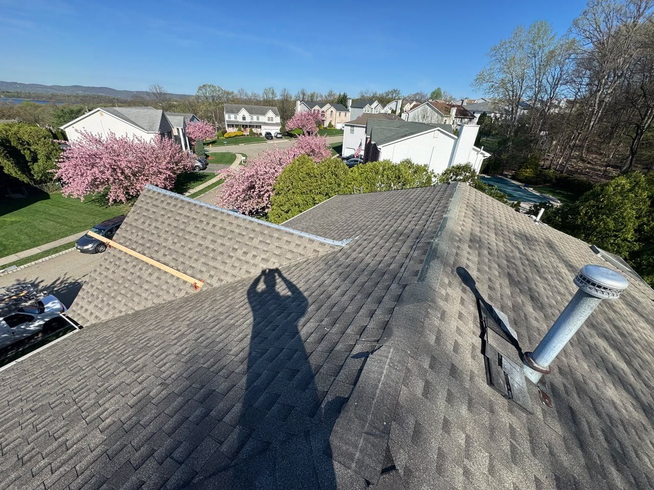 Asphalt shingle roof on a New Jersey home seen from the ridge