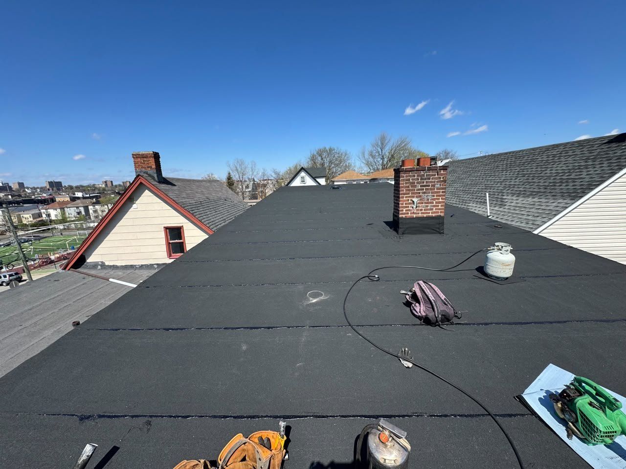 New flat roof with chimney and vent on a New Jersey home